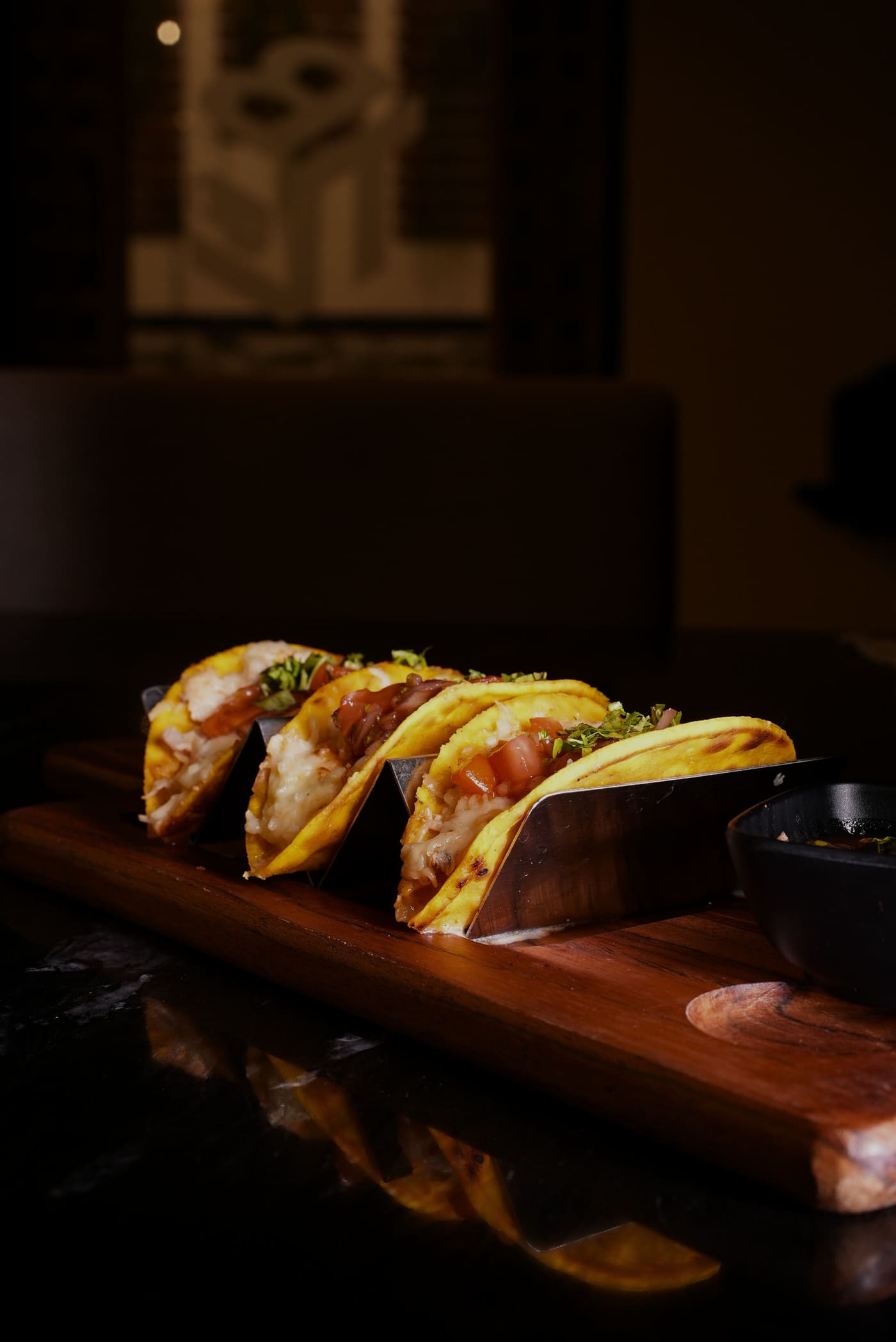 Loaded tacos in metal holder